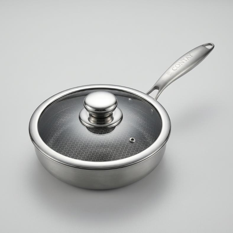 A stainless steel saucepan with a glass lid and a long handle, photographed on a clean light gray background. The brand name 'CORTEN' is visible on the handle.