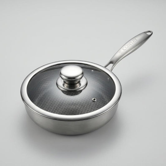 A stainless steel saucepan with a glass lid and a long handle, photographed on a clean light gray background. The brand name 'CORTEN' is visible on the handle.